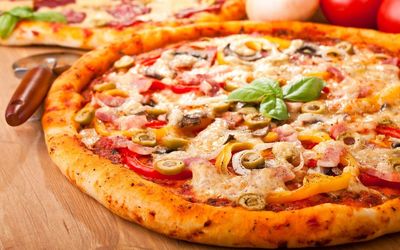 Close-up of pizza served on table