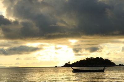 View of calm sea against cloudy sky