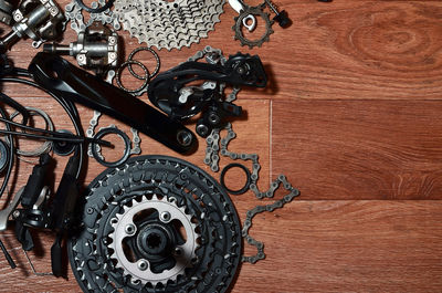Close-up of bicycle chains and gears on table