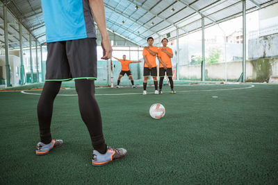 Players standing in soccer field