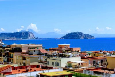 High angle view of townscape by sea