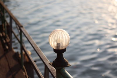 High angle view of railing by lake