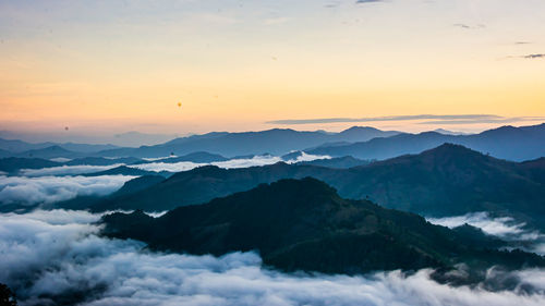 Scenic view of mountains against sky during sunset