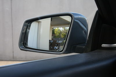 Reflection of road on side-view mirror