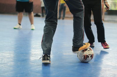 Low section of men playing soccer