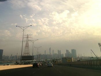 City street against cloudy sky