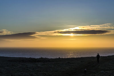 Scenic view of sea at sunset