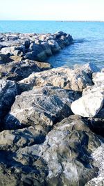 Close-up of beach against sky