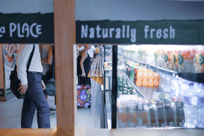 Information sign in store seen through glass window