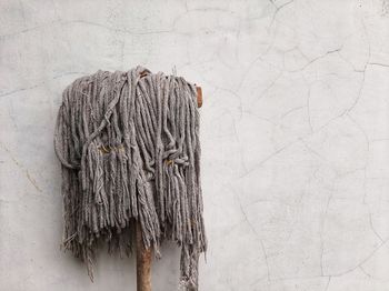 A mop leaned against the wall