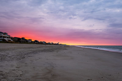 Scenic view of beach against sky during sunset