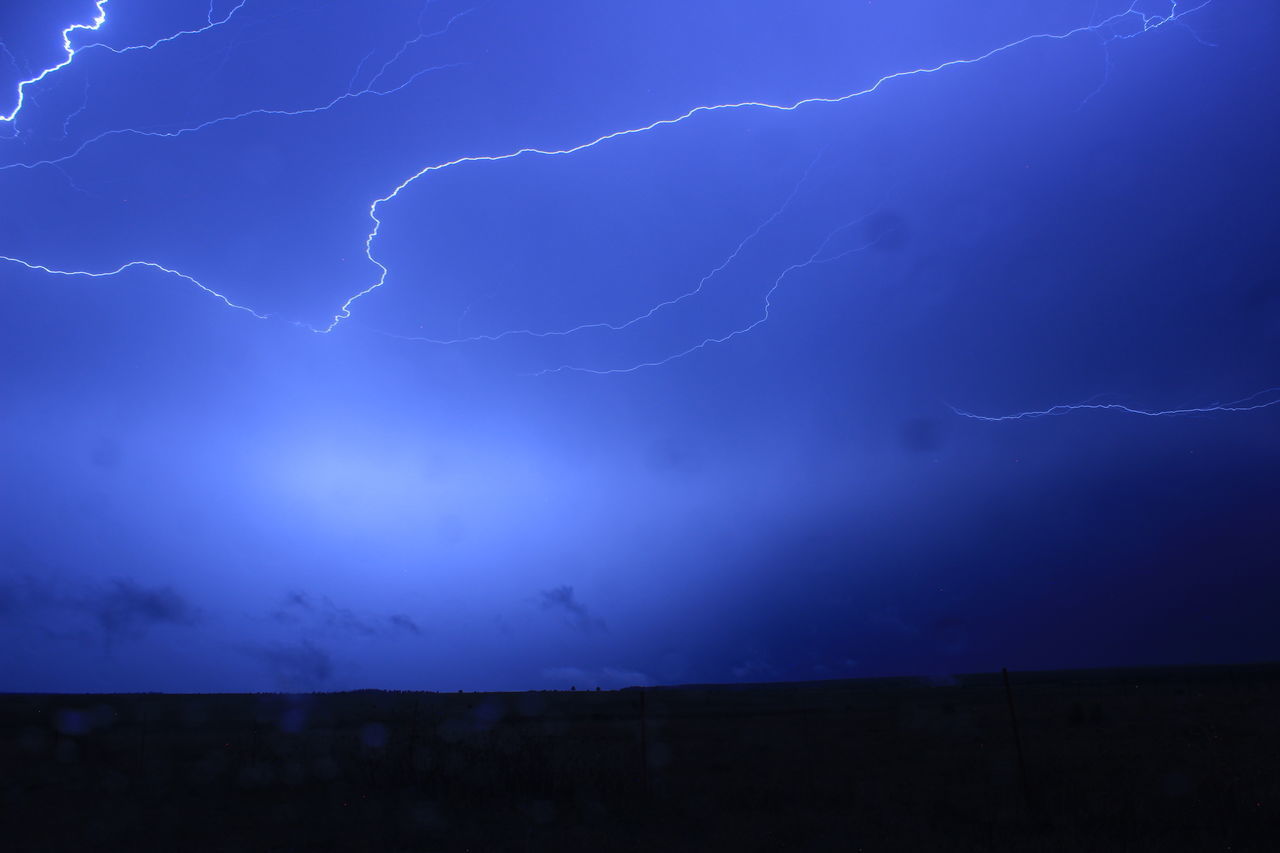 LOW ANGLE VIEW OF LIGHTNING IN SKY DURING NIGHT