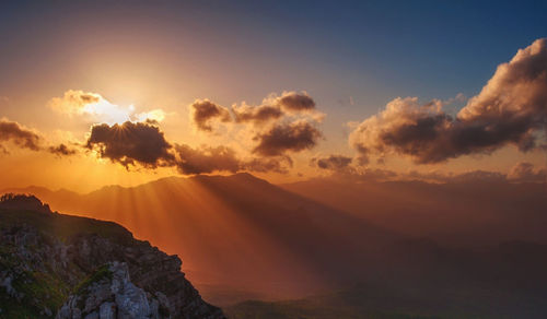 Scenic view of mountains against sky during sunset