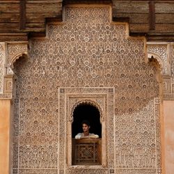 Portrait of woman in front of building