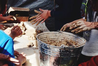 Midsection of people preparing food