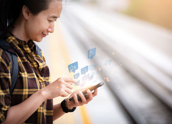 Young woman using mobile phone