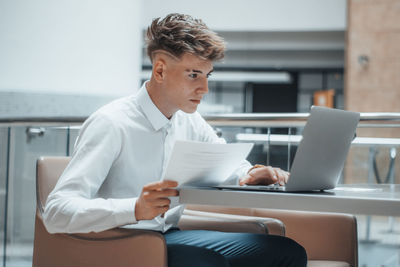 Young businessman working at office