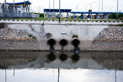 Reflection of built structure in puddle