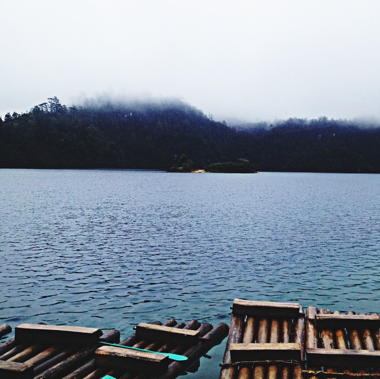 water, tranquil scene, tranquility, lake, scenics, clear sky, nature, beauty in nature, tree, pier, nautical vessel, idyllic, sky, copy space, day, mountain, outdoors, no people, river, non-urban scene