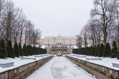 Snow covered buildings against sky