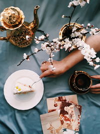 High angle view of hand holding coffee