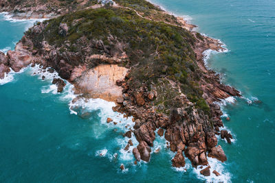 High angle view of rock formation in sea