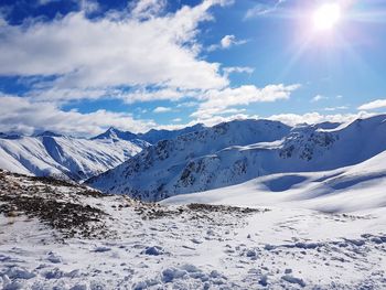 Scenic view of snowcapped mountains against sky