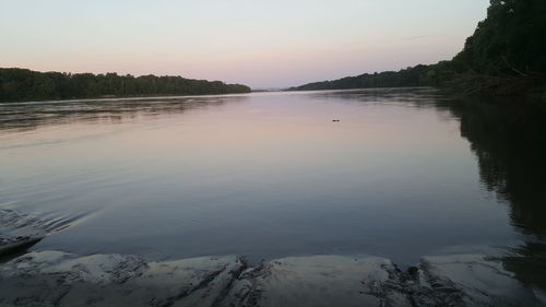 Scenic view of lake at sunset