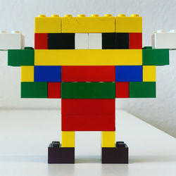 Close-up of toys against wall