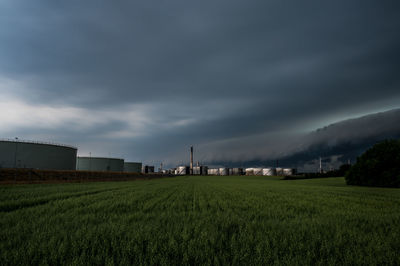 Storm clouds over crossbridge energy fredericia refinery, denmark