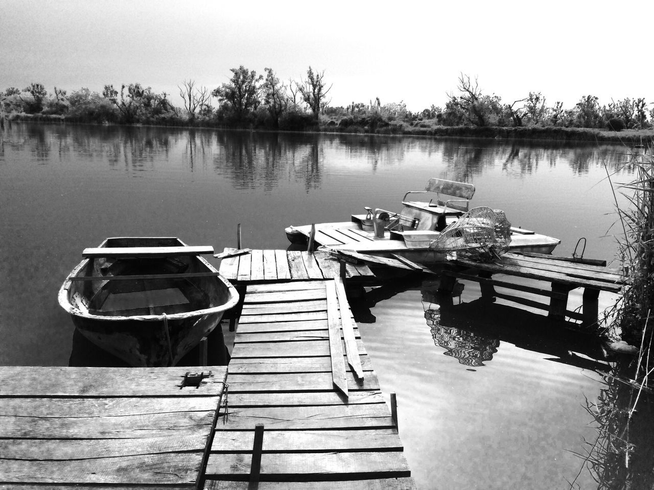 water, lake, reflection, pier, wood - material, tranquility, tranquil scene, moored, jetty, boat, wood, nature, nautical vessel, empty, absence, sky, beauty in nature, scenics, clear sky, outdoors