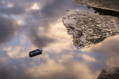 High angle view of reflection in puddle on lake