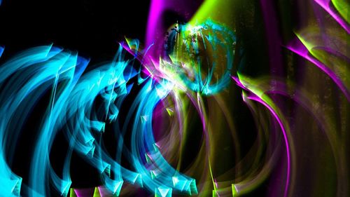 Close-up of light painting against black background
