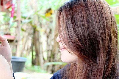 Close-up of young woman with brown hair