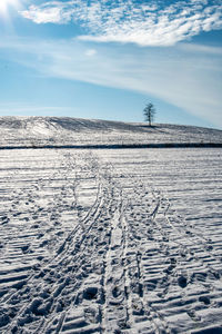 Scenic view of land against sky during winter