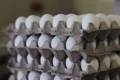 Close-up of stack of eggs in row