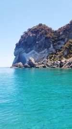 Scenic view of sea against clear blue sky