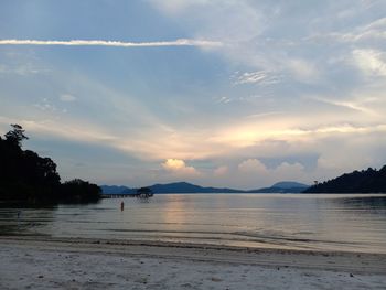 Scenic view of beach against sky during sunset