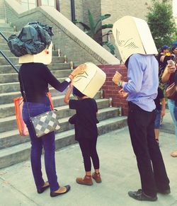 Rear view of couple standing in a city