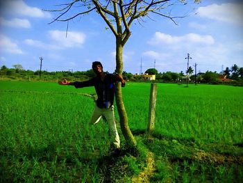 Man standing on grassy field