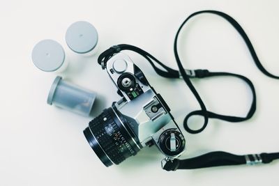 Close-up of eyeglasses on table against white background