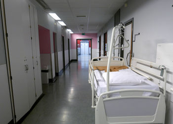 Bed in hospital corridor