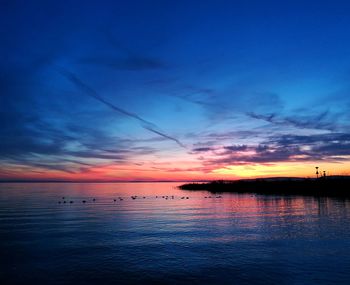 Scenic view of sea against sky at sunset