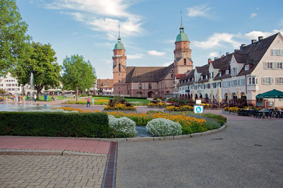 Panoramic view of buildings and city against sky