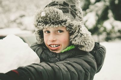 Portrait of boy in snow