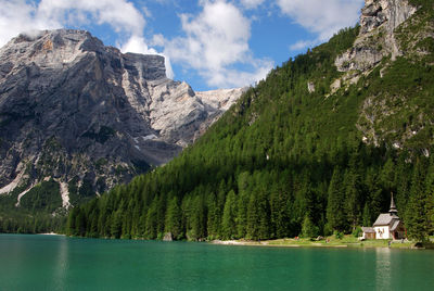 Scenic view of lake and mountains against sky