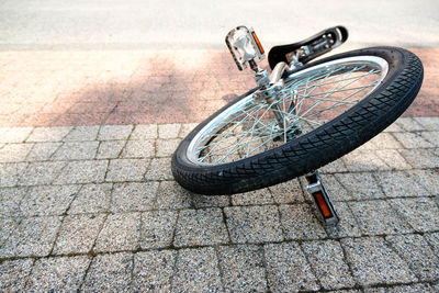 Close-up of unicycle on footpath