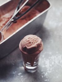 High angle view of ice cream melting in glass