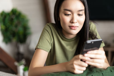 Young woman using mobile phone