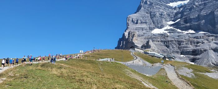 Scenic view of mountains against clear blue sky